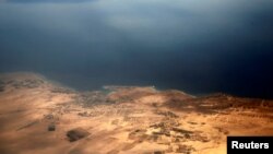 An aerial view of the coast of the Red Sea and the two islands of Tiran and Sanafir is pictured through the window of an airplane near Sharm el-Sheikh, Egypt, Nov. 1, 2016. 