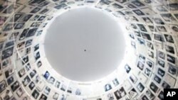 An Ultra Orthodox Jewish man visits the Hall of Names at the Yad Vashem Holocaust Memorial in Jerusalem, Sunday, May 1, 2011.