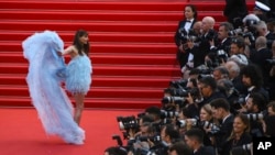 Frederique Bel poses for photographers upon arrival at the opening ceremony and the premiere of the film 'Final Cut' at the 75th international film festival, Cannes, southern France, Tuesday, May 17, 2022. (AP Photo/Dionisia Vasilopoulou)