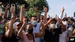 Anti-government protesters march in Havana, Cuba, July 11, 2021. As Cubans facing the country's worst economic crisis in decades took to the streets in droves over the weekend into July 12, 2021, authorities blocked social media sites.