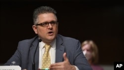 FILE - Federal Housing Finance Agency Director Mark Calabria testifies before a Senate Banking, Housing, and Urban Affairs Committee hearing on Capitol Hill in Washington, June 9, 2020. 