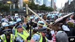 Demonstrators clash with police near the Israeli Consulate during the Democratic National Convention Aug. 20, 2024, in Chicago.