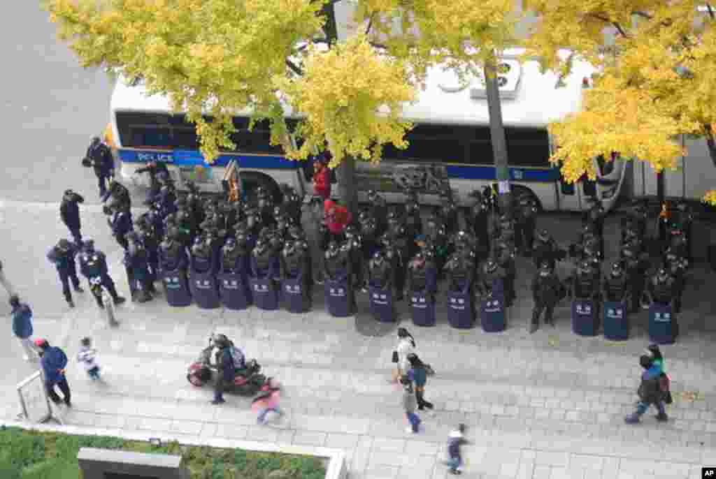 A squad of riot police in front of the Korea Press Center in downtown Seoul.