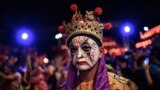 A participant from Taiwan performs during the Cap Go Meh festival, marking the 15th and final day of the Lunar New Year celebrations, in Bogor, West Java, on Feb. 12, 2025. 