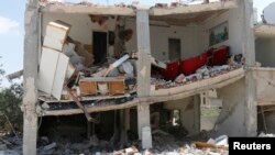 On going fighting in Syria caused damage to the building pictured, in the town of Morek in Hama province, July 21, 2014. 