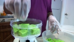 The baskets include sweet treats such as coconut candy. (Dave Grunebaum/VOA)