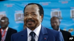 FILE - Cameroonian President Paul Biya makes an appearance during elections in Yaounde, Cameroon, on Oct. 7, 2018. A government spokesperson says Biya will announce whether he will run again in 2025 shortly before that election.