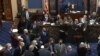FILE - Senators are seen debating on the Senate floor on Capitol Hill in Washington, Feb. 10, 2021. (Senate Television via AP)
