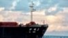 FILE - The Chinese bulk carrier Yi Peng 3 is anchored and being monitored by a Danish naval patrol vessel (unseen) in the sea of Kattegat, near the City og Granaa in Jutland, Denmark, on November 20, 2024.