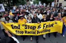 FILE - This June 17, 2012, photo shows Rev. Al Sharpton, center, with demonstrators during a silent march to end the "stop-and-frisk" program in New York.
