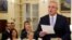 New Australian Prime Minister Scott Morrison is seen at his swearing-in ceremony as his wife Jenny looks on, in Canberra, Australia, Aug. 24, 2018.