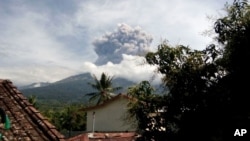 Volcanic material from the eruption of Mount Barujari is seen from Bayan, Lombok Island, Indonesia, Sept. 27, 2016.