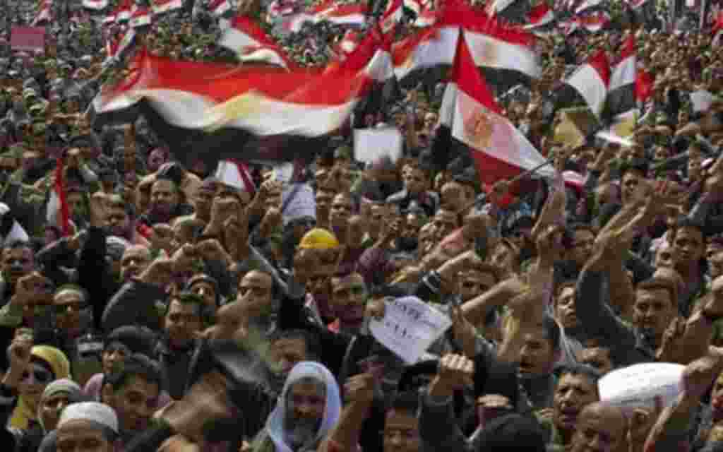 Thousands of Egyptian anti-Mubarak protesters shout slogans as they take part in a demonstration at Tahrir square in Cairo, Egypt, Tuesday, Feb. 8, 2011. (AP Photo/Emilio Morenatti)
