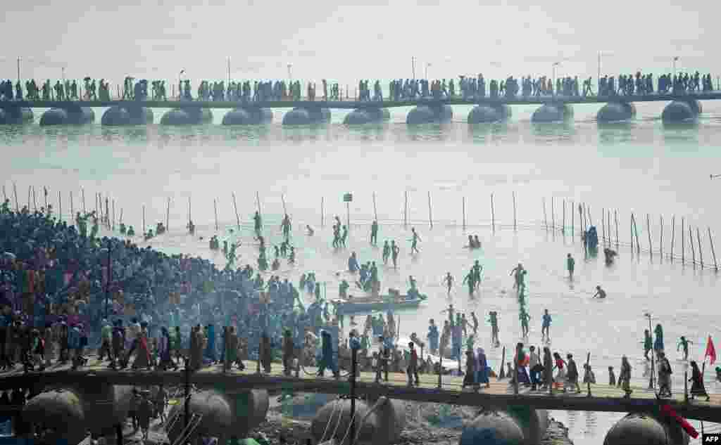 Indian Hindu devotees gather on the banks of the river Ganges to take a &#39;holy dip&#39; on the occasion of Maghi Purnima during the annual traditional fair &#39;Magh Mela&#39; in Allahabad.