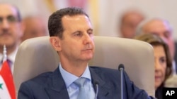 (arquivo) Presidente sírio Bashar Assad na cimeira árabe, em Jeddah, Arábia saudita, 19 Maio 2023