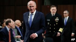 From left, National Intelligence Director Dan Coats, National Security Agency director Adm. Michael Rogers and acting FBI Director Andrew McCabe, arrive for the Senate Intelligence Committee hearing about the Foreign Intelligence Surveillance Act, on Capi