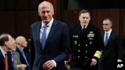 From left, National Intelligence Director Dan Coats, National Security Agency director Adm. Michael Rogers and acting FBI Director Andrew McCabe, arrive for the Senate Intelligence Committee hearing about the Foreign Intelligence Surveillance Act, on Capitol Hill, June 7, 2017, in Washington.