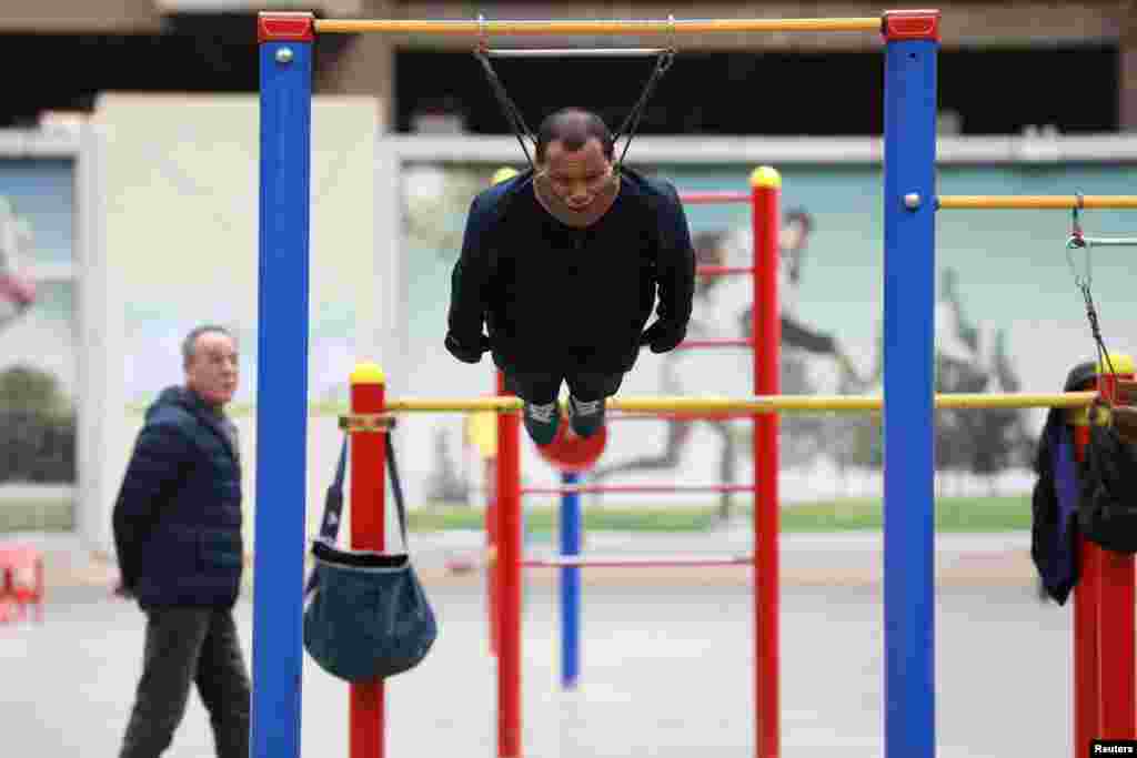 Sun Rongchun, 57, exercises at a sports complex in Shenyang, Liaoning province, China, April 9, 2019.