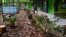 Pieces of roof tiles and other debris litter the ground at a school following an earthquake in Malang, East Java, Indonesia, April 10, 2021.
