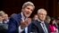 Secretary of State John Kerry, left, and Defense Secretary Chuck Hagel, right, appear before the Senate Foreign Relations Committee, Sept. 3, 2013, on Capitol Hill in Washington. 