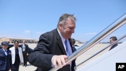 Secretary of State Mike Pompeo boards a plane at Andrews Air Force Base, Md., Tuesday, July 30, 2019. 