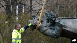 The statue of a Soviet World War II commander Marshal Ivan Konev is loaded onto a truck after being removed from its site in Prague, Czech Republic, April 3, 2020. 