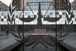 FILE - A person leaves the International Criminal Court in The Hague, Netherlands, Jan. 16, 2019.