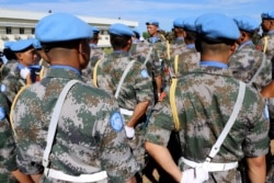FILE - Chinese Peacekeepers of the UN Mission to South Sudan parade during the International Day of UN Peacekeepers in Juba, May 29, 2017.
