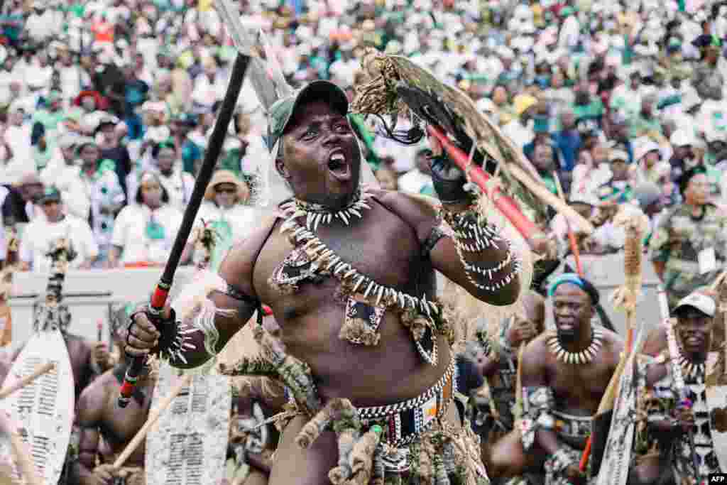 An Amabutho (Zulu regiment) gestures at Umkhonto We Sizwe (MKP) party supporters gathering during the party&#39;s first anniversary celebrations at the Moses Mabhida stadium in Durban, South Africa.