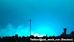 Bright blue light is seen after a transformer explosion Dec. 27, 2018, at an electric power station in the New York City borough of Queens.
