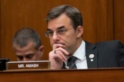 FILE - Rep. Justin Amash listens during a House committee hearing on Capitol Hill in Washington, June 12, 2019.