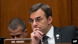 FILE - Rep. Justin Amash listens during a House committee hearing on Capitol Hill in Washington, June 12, 2019.