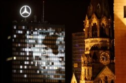 A general view of a projection next to Kaiser Wilhelm Gedaechtniskirche church at Breitscheidplatz square in Berlin, Nov. 4, 2019.