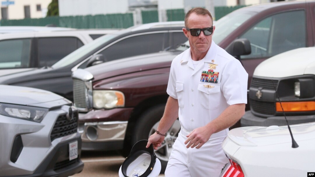 FILE - Navy Special Operations Chief Edward Gallagher walks into military court in San Diego, California, June 21, 2019. 