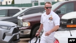 FILE - Navy Special Operations Chief Edward Gallagher walks into military court in San Diego, California, June 21, 2019. 