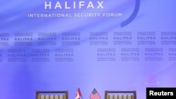 FILE - The backdrop and the Canadian and U.S. participants' chairs are seen at the Halifax International Security Forum, in Halifax, Nova Scotia, Canada, Nov. 22, 2013. Due to the coronavirus pandemic, this year's forum was held virtually.
