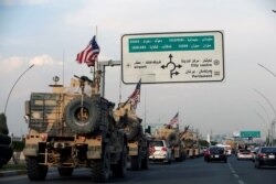 A convoy of U.S. vehicles is seen after withdrawing from northern Syria, in Erbil, Iraq, Oct. 21, 2019.