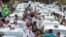 Taxi drivers block a street to protest the Uber ride-sharing service outside city council headquarters in downtown Sao Paulo, Brazil, Sept. 9, 2015.
