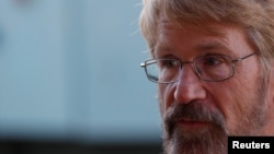 Christopher Cantrell, Atmosphere Chemistry Professor at Colorado Boulder University, speaks during an interview with Reuters at the One Planet Summit, near Paris, Dec. 12, 2017.