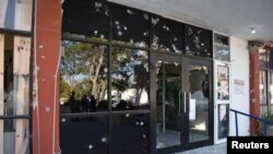 A view of the bullet-riddled facade of the town hall of Villa Union after clashes sparked by suspected cartel gunmen in a northern Mexican town killed 20 people this weekend in Villa Union, in Coahuila state, Mexico December 1, 2019.