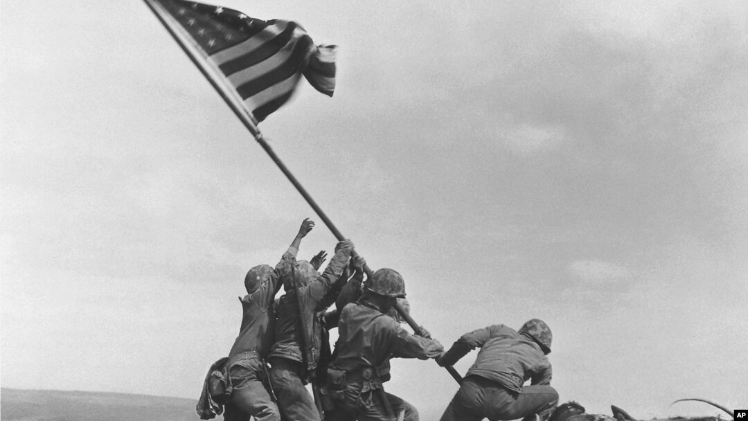 FILE - U.S. Marines raise the American flag atop Mount Suribachi, Iwo Jima, Japan, Feb. 23, 1945. The Marines Corps said Thursday that Private First Class Harold Schultz of Detroit was in the photo and that Navy Pharmacist's Mate 2nd Class John Bradley wasn't.