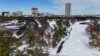 A drone picture shows snow covering Hermann Park and the downtown Houston skyline in the distance in Houston, Texas, Jan. 21, 2025. 