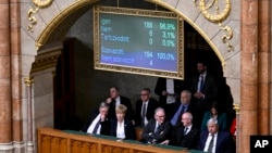 A display shows results during a vote by lawmakers on Sweden's accession into NATO, in Budapest, Hungary, Feb 26, 2024. 