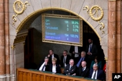 A display shows results during a vote by lawmakers on Sweden's accession into NATO, in Budapest, Hungary, Feb 26, 2024.