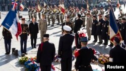 France's President Francois Hollande attends a ceremony to commemorate the end of the World War I at the Arc de Triomphe in Paris, Nov. 11, 2013.