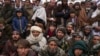FILE - Hundreds of Afghan men gather for humanitarian aid in Qala-e-Naw, Afghanistan, on Dec. 14, 2021. The U.S. remains the largest aid donor to Afghanistan, and a report released July 17, 2024, says some U.S. aid could have ended up in the hands of extremists.