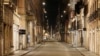 An empty Via del Corso is seen following the imposition of a curfew from 10 p.m. to 5 a.m., as part of tougher measures to tackle the spread of the coronavirus disease (COVID-19), in Rome, Nov. 7, 2020.