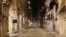 An empty Via del Corso is seen following the imposition of a curfew from 10 p.m. to 5 a.m., as part of tougher measures to tackle the spread of the coronavirus disease (COVID-19), in Rome, Nov. 7, 2020.