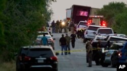 Police and other first responders say dozens of people have been found dead and multiple others were taken to hospitals with heat-related illnesses after a semitrailer containing suspected migrants was found, Monday, June 27, 2022, in San Antonio. (AP Photo/Eric Gay)