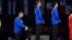 FILE - Race Imboden, left, of the U.S. kneels during the national anthem at the Lima Convention Center, during the Pan American Games Lima 2019, in this Aug. 9, 2019, handout picture released by Lima 2019.